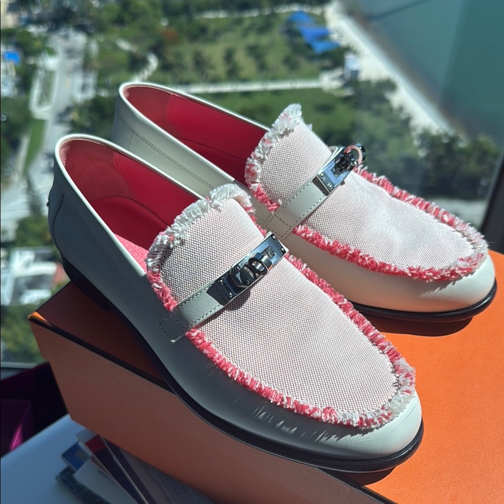 Hermes Loafers with lock & fringe details.